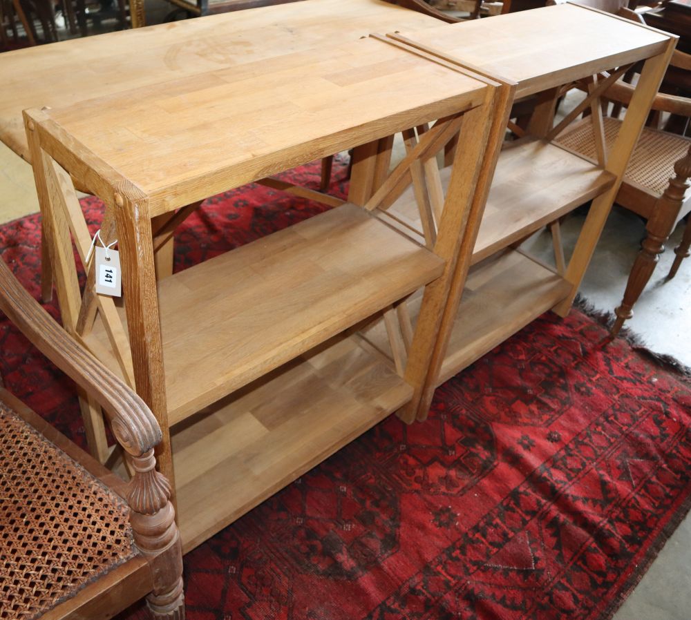 A pair of contemporary oak dwarf open bookcases, W.70cm, D.30cm, H.87cm